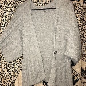Grey knitted cardigan.